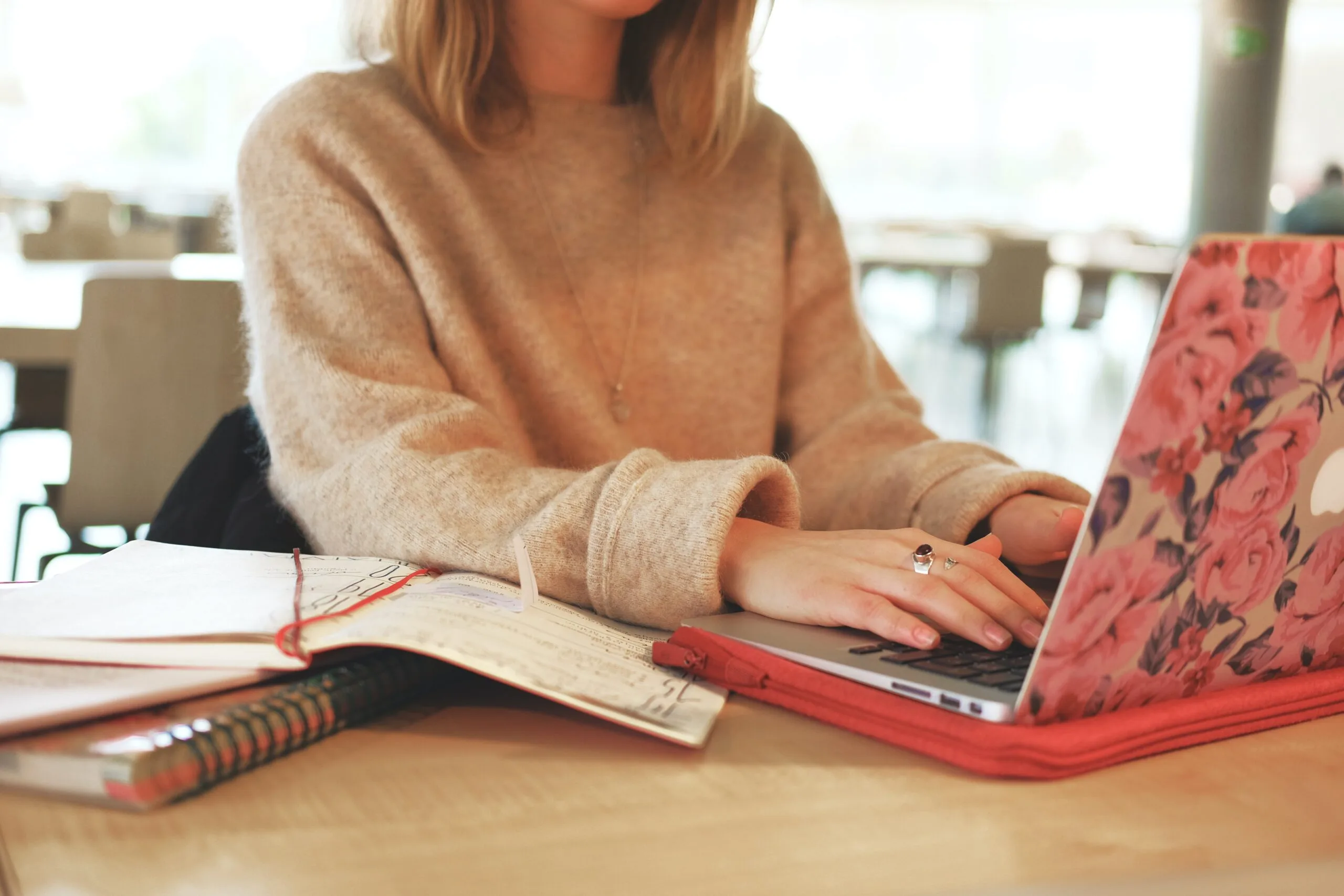 Female typing on MacBook