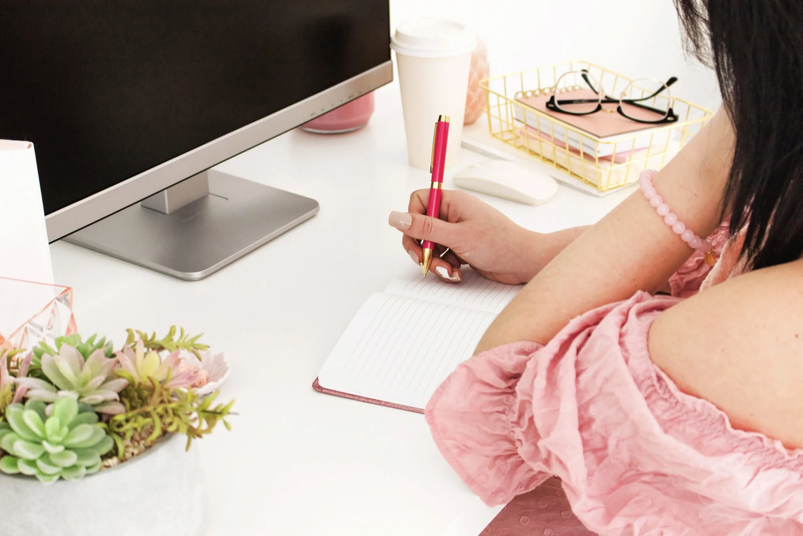 Female writing in notebook