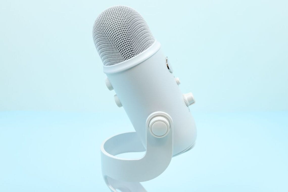 White Blue Yeti Microphone on a blue background