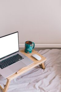 laptop on tray with coffee
