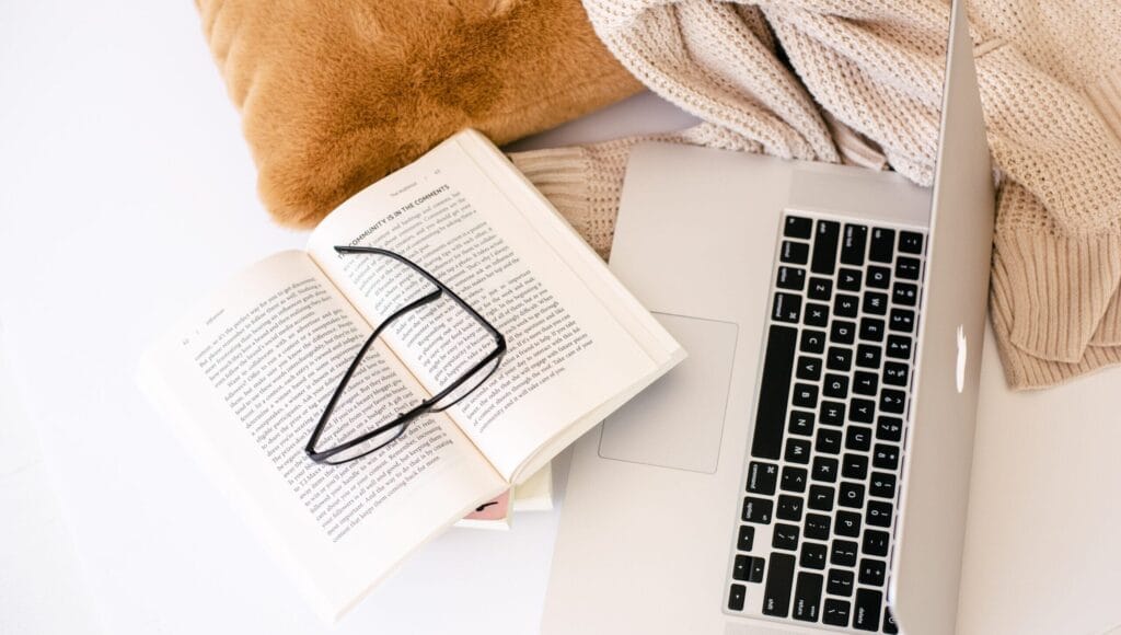 Book, glasses, laptop