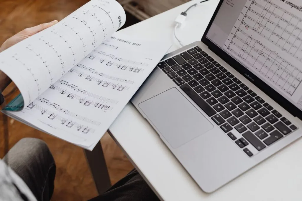 sheet music and laptop