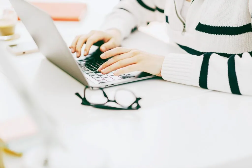 Female typing on laptop