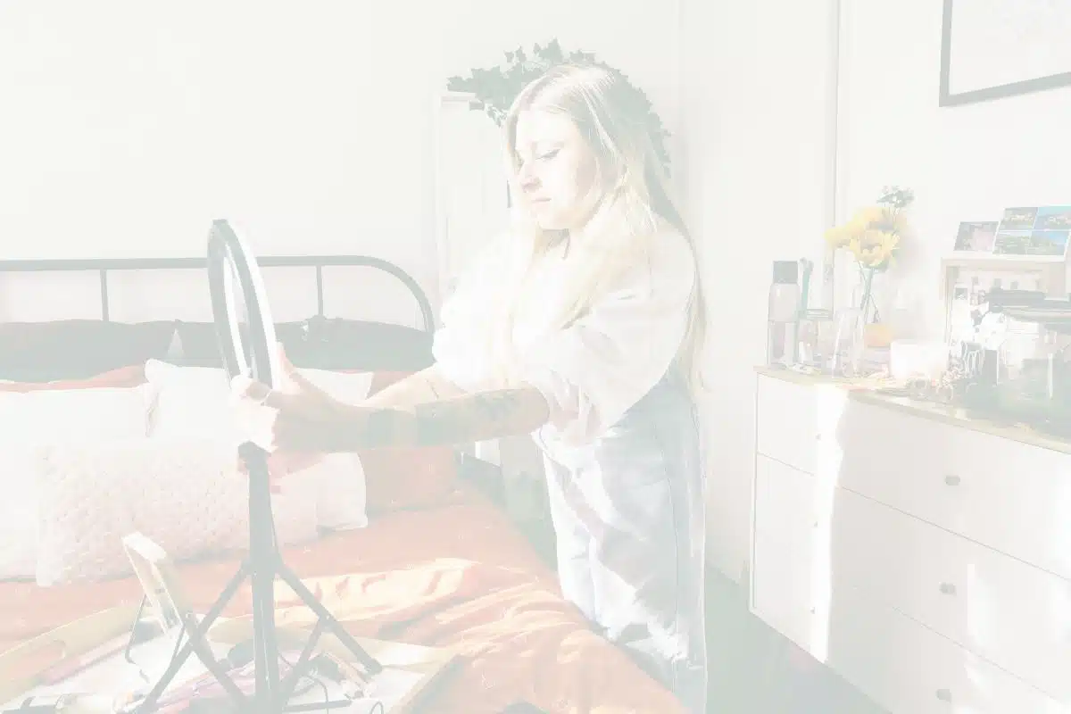 Woman setting up for filming a TikTok video - will she be affected by a potential TikTok ban?